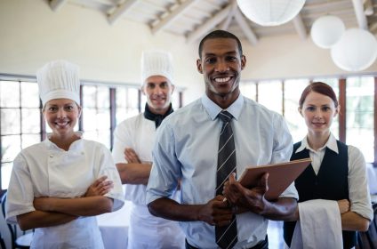 Group of hotel staffs standing in hotel